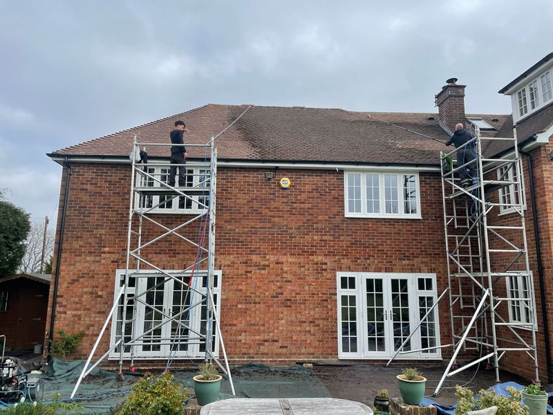 Roof cleaning carried out safely from scaffold towers by The Roof Moss Cleaners in Liss
